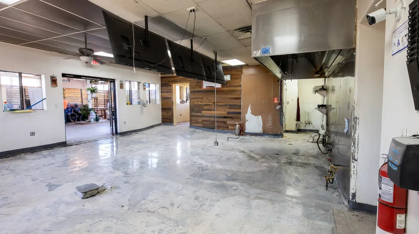 Commercial unit with a worn floor before installation