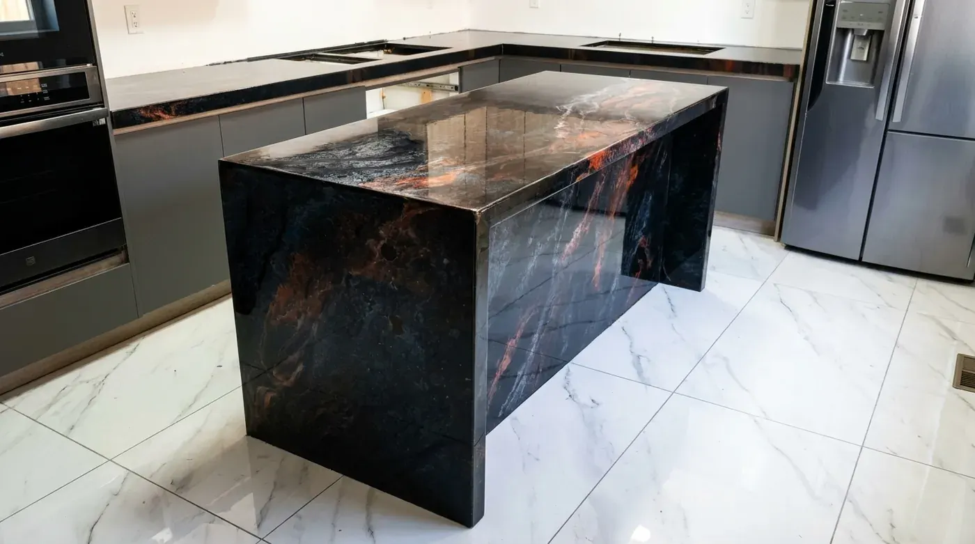 Kitchen island coated in dark metallic epoxy