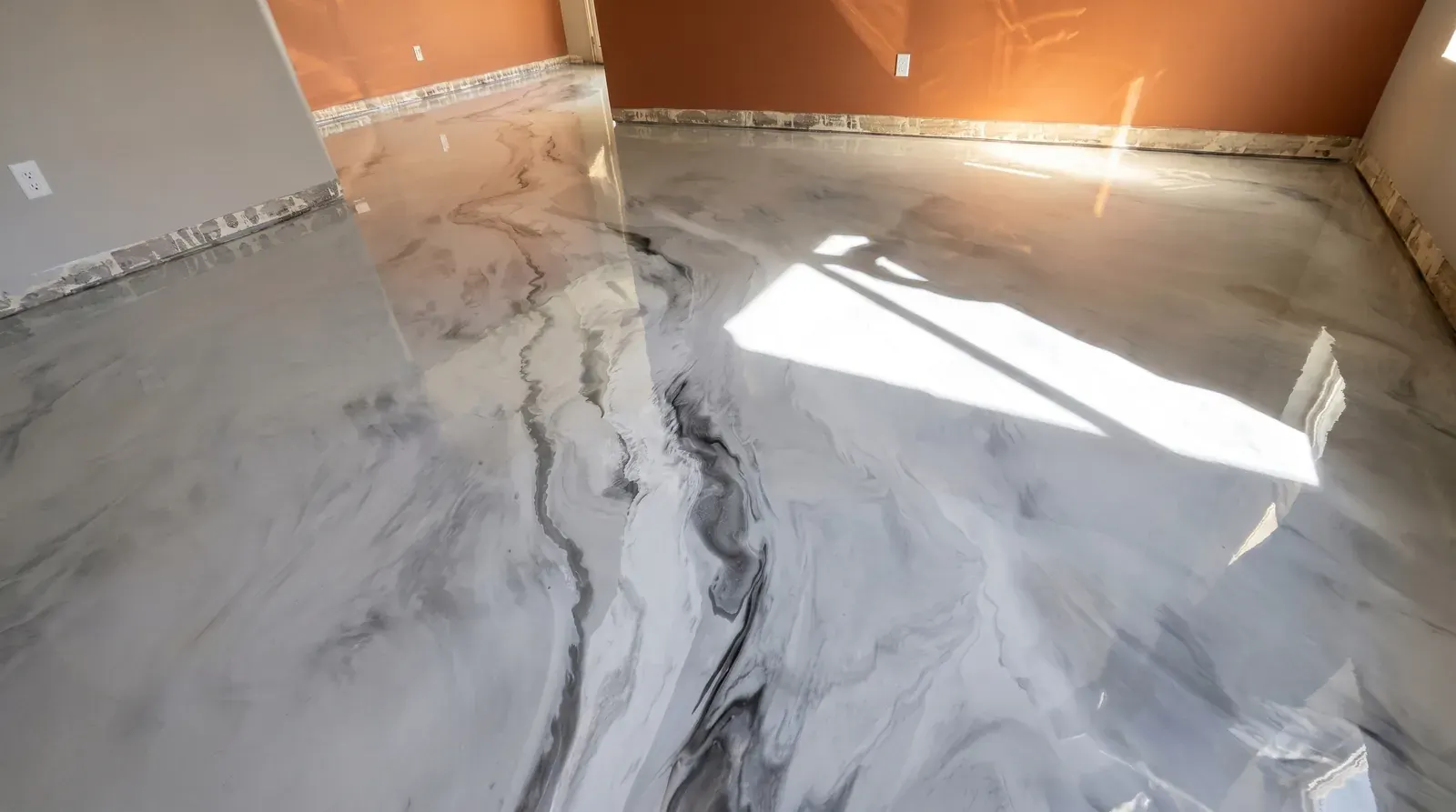 White and grey metallic marble epoxy floor installed in a living room