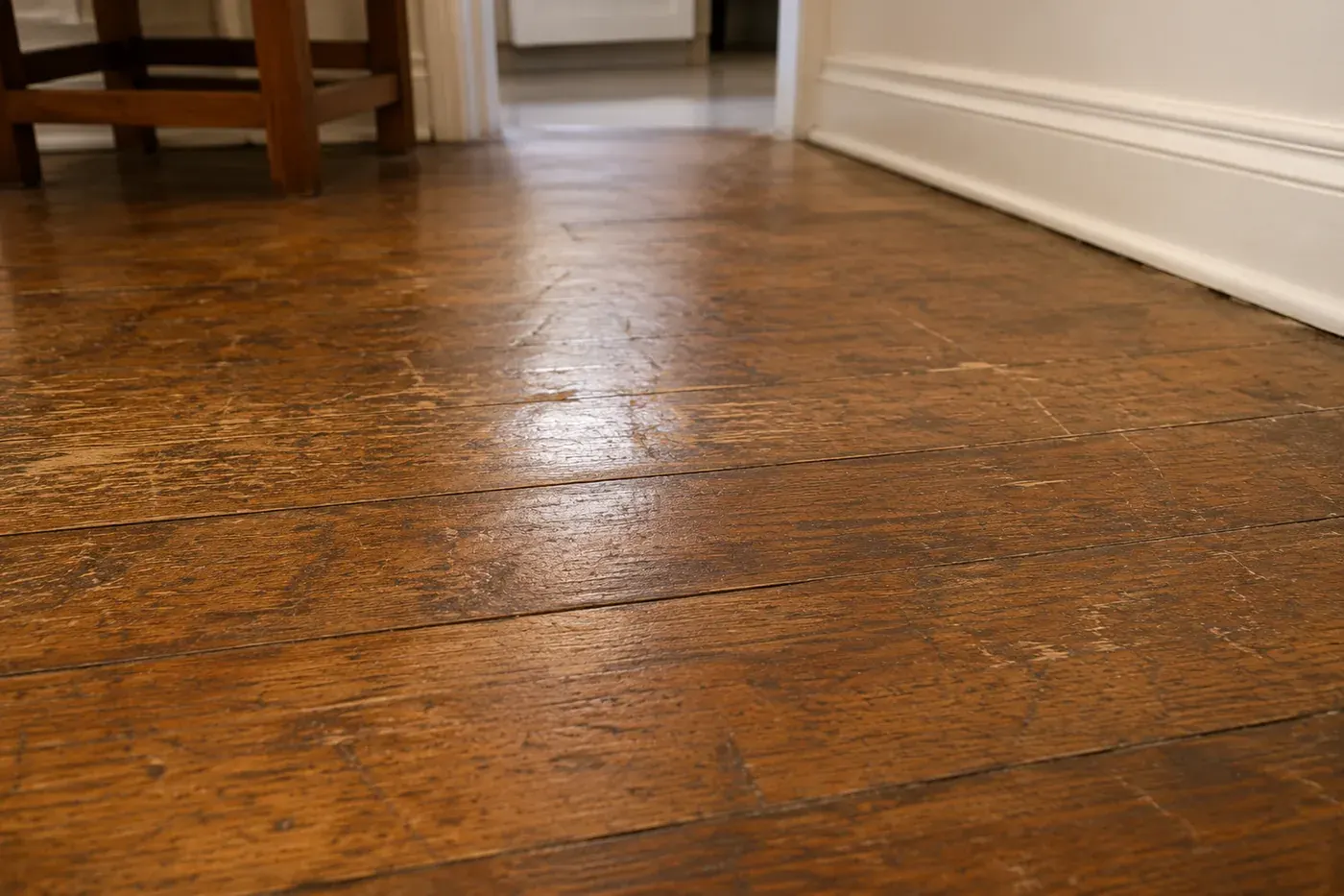 Worn interior wood floor before installation